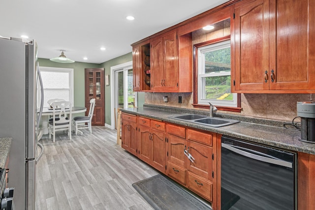 7912 Hillside Trl S, Cottage Grove, MN 55016 - kitchen with dishwasher, freestanding refrigerator, a sink, dark countertops, and plenty of natural light