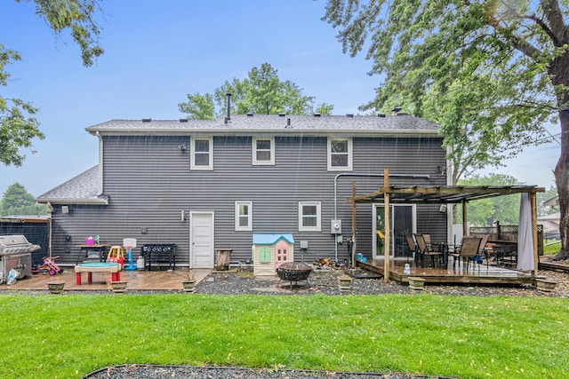 7912 Hillside Trl S, Cottage Grove, MN 55016 - back of house featuring a fire pit, a wooden deck, a pergola, a yard, and a patio area