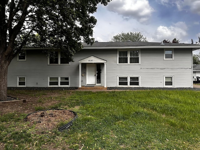 bi-level home featuring a front yard