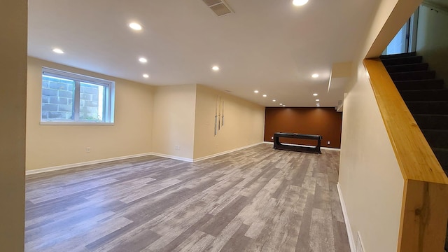 2714 Colleen St NE, Rochester, MN 55906 - below grade area featuring wood finished floors, recessed lighting, baseboards, and stairway