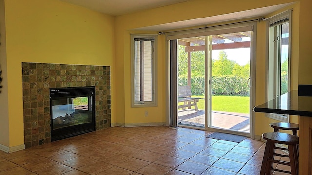 2714 Colleen St NE, Rochester, MN 55906 - entryway with baseboards, tile patterned flooring, and a fireplace