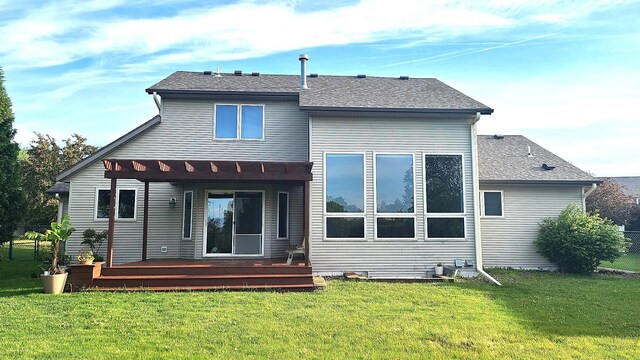 2714 Colleen St NE, Rochester, MN 55906 - back of house with a wooden deck and a lawn