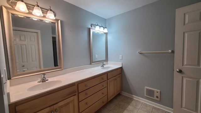 2714 Colleen St NE, Rochester, MN 55906 - full bath featuring double vanity and tile patterned flooring