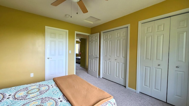 2714 Colleen St NE, Rochester, MN 55906 - carpeted bedroom with multiple closets and a ceiling fan