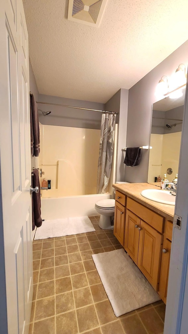 2714 Colleen St NE, Rochester, MN 55906 - bathroom with shower / bathtub combination with curtain, vanity, a textured ceiling, and tile patterned floors