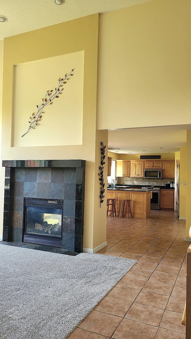 2714 Colleen St NE, Rochester, MN 55906 - living room with a tile fireplace and light tile patterned floors