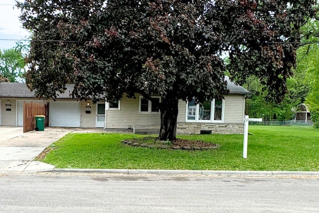view of property hidden behind natural elements with concrete driveway, an attached garage, and stone siding