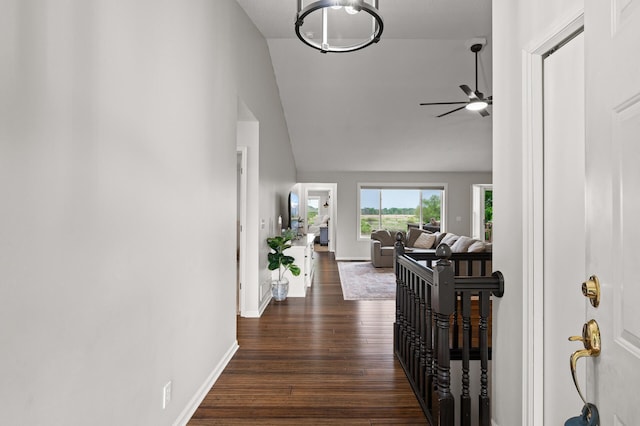 4756 121st Ave NE, Blaine, MN 55449 - corridor featuring dark wood-style floors, baseboards, and high vaulted ceiling