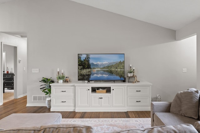 4756 121st Ave NE, Blaine, MN 55449 - living room with wood finished floors, baseboards, and high vaulted ceiling
