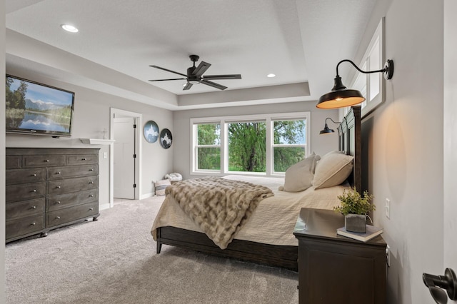 4756 121st Ave NE, Blaine, MN 55449 - carpeted bedroom with baseboards, a raised ceiling, recessed lighting, and ceiling fan