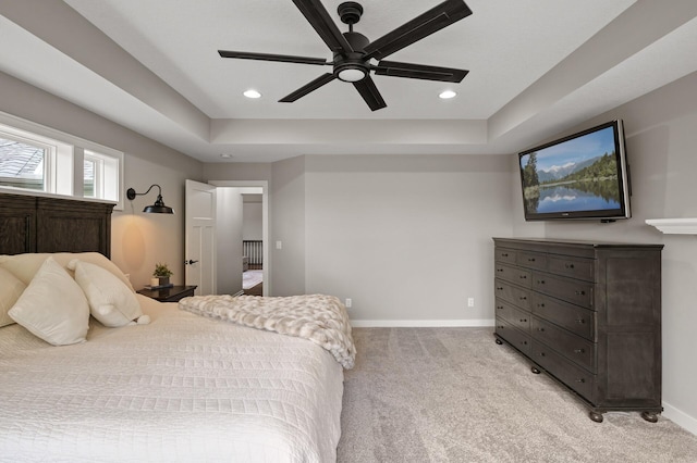 4756 121st Ave NE, Blaine, MN 55449 - bedroom with light carpet, a tray ceiling, baseboards, recessed lighting, and ceiling fan