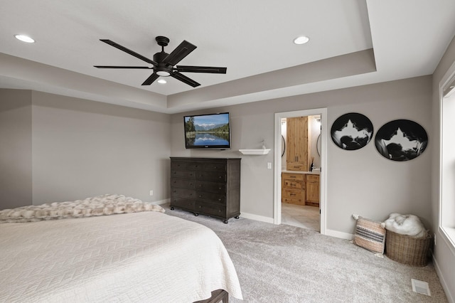 4756 121st Ave NE, Blaine, MN 55449 - bedroom featuring baseboards, light colored carpet, recessed lighting, a raised ceiling, and connected bathroom