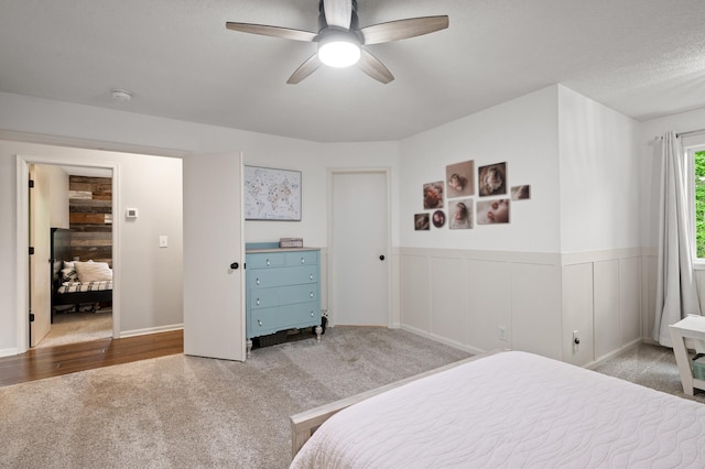 4756 121st Ave NE, Blaine, MN 55449 - bedroom with carpet flooring, wainscoting, and ceiling fan