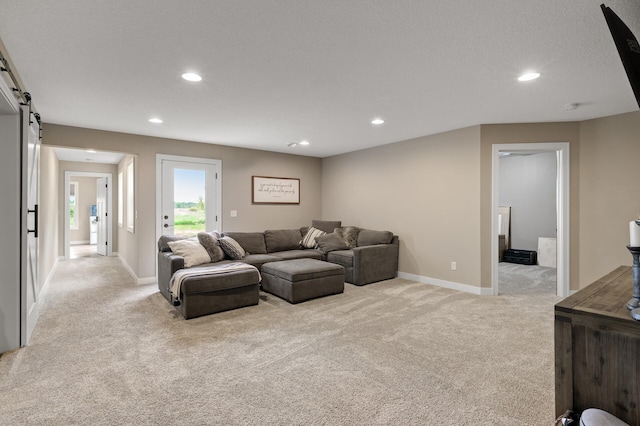 4756 121st Ave NE, Blaine, MN 55449 - living area with light carpet, recessed lighting, baseboards, and a barn door