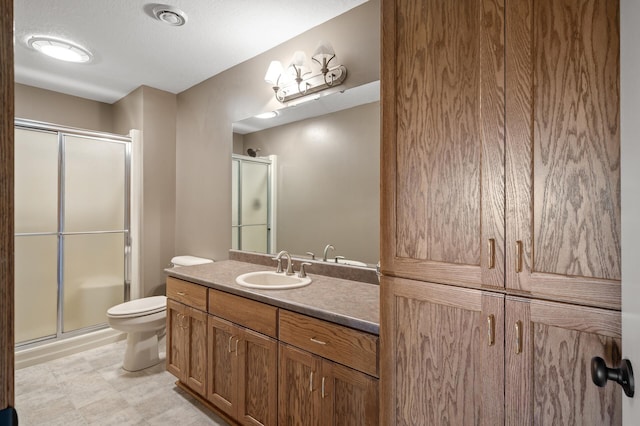 4756 121st Ave NE, Blaine, MN 55449 - full bathroom featuring vanity, a shower stall, and toilet