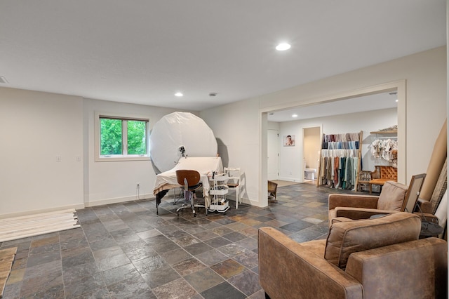 4756 121st Ave NE, Blaine, MN 55449 - living room with baseboards, stone tile flooring, and recessed lighting