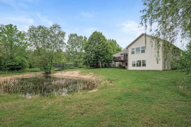 4756 121st Ave NE, Blaine, MN 55449 - view of grassy yard featuring a trampoline and a deck