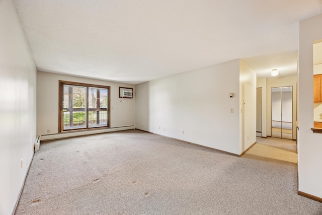 999 41st Ave NE Unit 110Ne, Columbia Heights, MN 55421 - spare room featuring light carpet, a baseboard heating unit, and baseboards