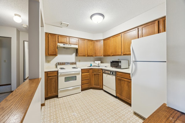 999 41st Ave NE Unit 110Ne, Columbia Heights, MN 55421 - kitchen featuring white appliances, brown cabinets, under cabinet range hood, and a textured ceiling