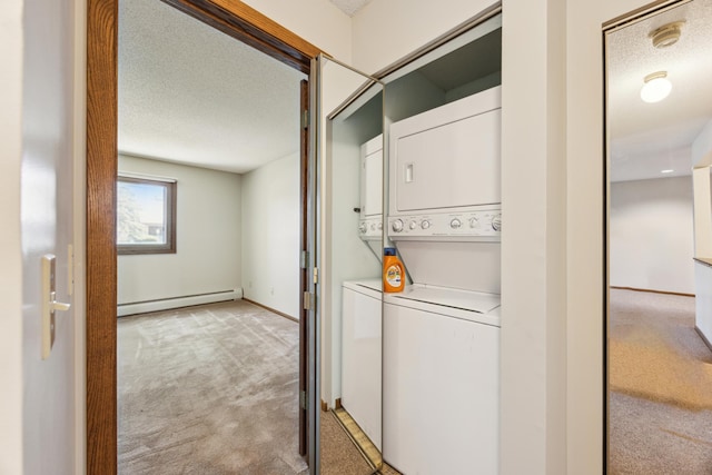 999 41st Ave NE Unit 110Ne, Columbia Heights, MN 55421 - laundry area featuring a baseboard heating unit, estacked washer and dryer, light colored carpet, and a textured ceiling