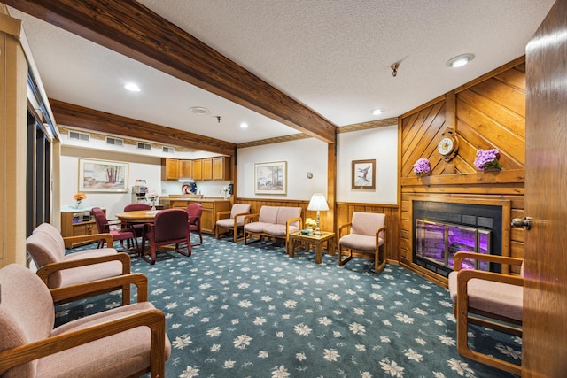 999 41st Ave NE Unit 110Ne, Columbia Heights, MN 55421 - living area with carpet flooring, wood walls, beamed ceiling, a glass covered fireplace, and a wainscoted wall