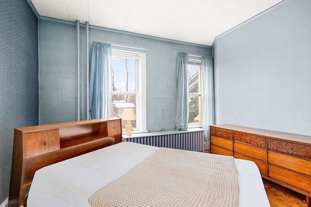 bedroom featuring radiator