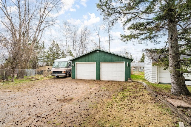 detached garage with fence