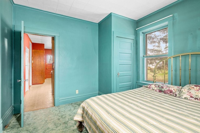 carpeted bedroom with baseboards