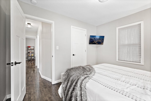 37 Harrison Ave S, Hopkins, MN 55343 - bedroom featuring dark wood-style flooring and a closet