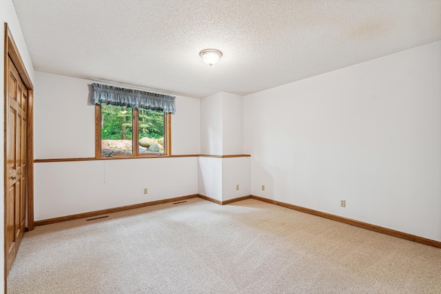 10791 3rd Street Pl N, Lake Elmo, MN 55042 - carpeted spare room featuring a textured ceiling and baseboards
