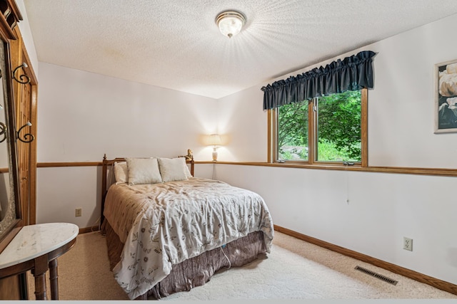 10791 3rd Street Pl N, Lake Elmo, MN 55042 - carpeted bedroom featuring a textured ceiling and baseboards