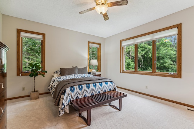 10791 3rd Street Pl N, Lake Elmo, MN 55042 - bedroom featuring light carpet, baseboards, and a ceiling fan