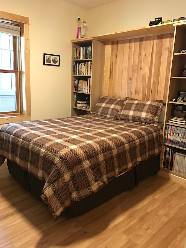 bedroom featuring wood finished floors