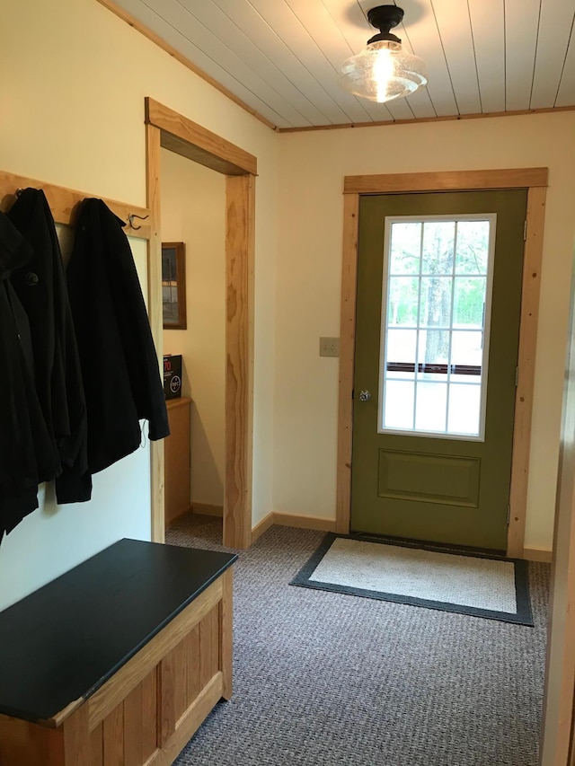 mudroom with carpet flooring and baseboards
