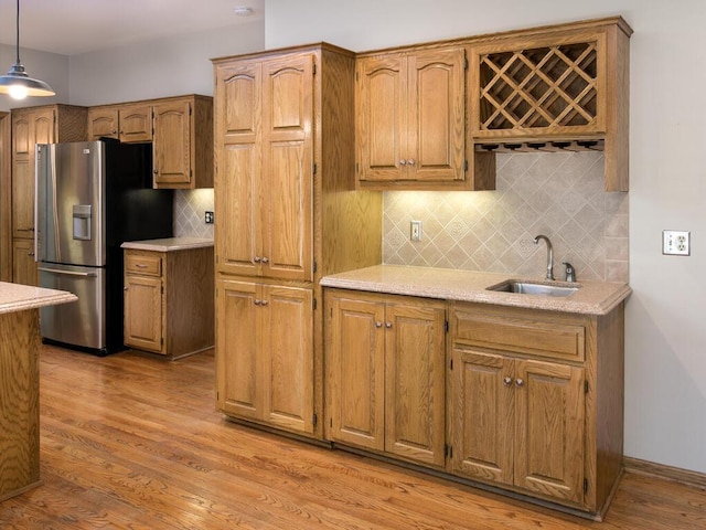 17768 Keystone Ave, Lakeville, MN 55044 - kitchen with stainless steel refrigerator with ice dispenser, a sink, light countertops, and tasteful backsplash
