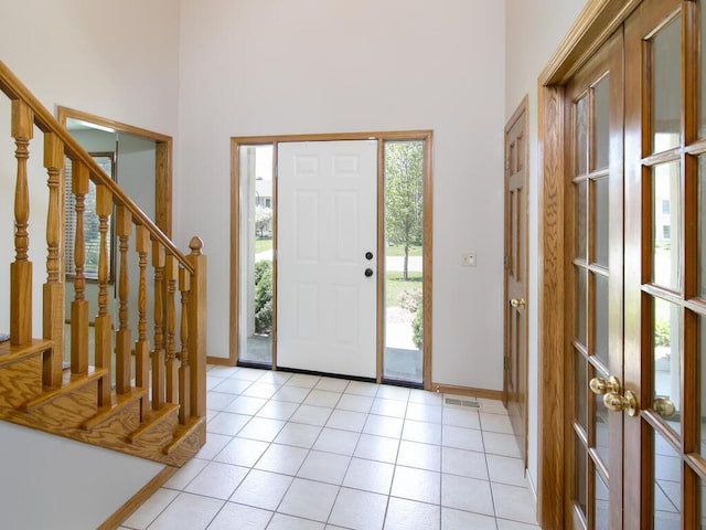 17768 Keystone Ave, Lakeville, MN 55044 - entryway with a towering ceiling, plenty of natural light, baseboards, and stairway
