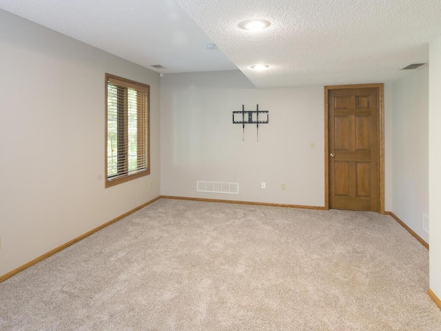17768 Keystone Ave, Lakeville, MN 55044 - spare room with light colored carpet, baseboards, and a textured ceiling
