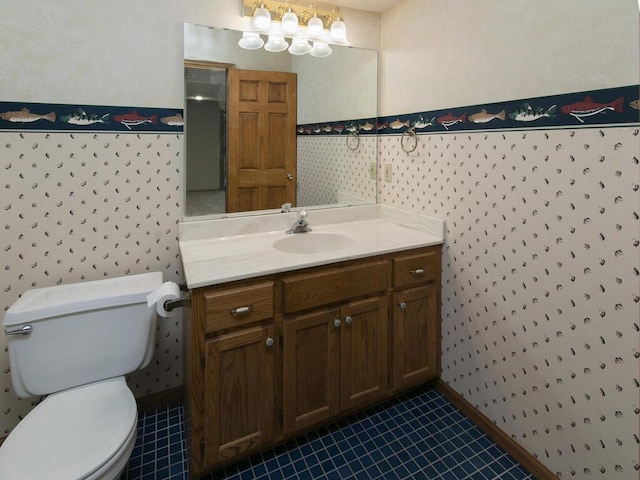 17768 Keystone Ave, Lakeville, MN 55044 - bathroom with vanity, toilet, tile patterned flooring, wallpapered walls, and baseboards