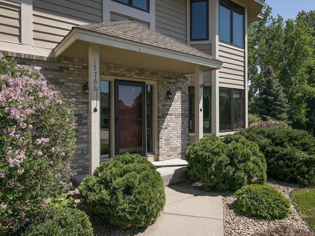 17768 Keystone Ave, Lakeville, MN 55044 - property entrance with brick siding and a shingled roof