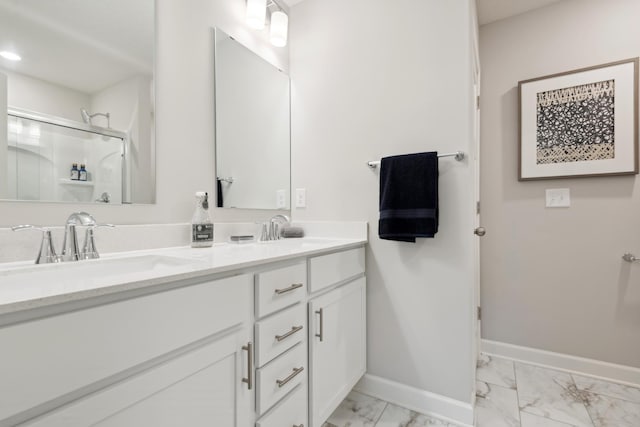 6749 168th Ln N, Ramsey, MN 55303 - bathroom with marble look tile flooring, baseboards, a shower with door, and double vanity