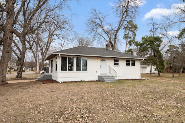 761 Labore Rd, Little Canada, MN 55117 - rear view of house with a chimney, roof with shingles, stucco siding, and entry steps