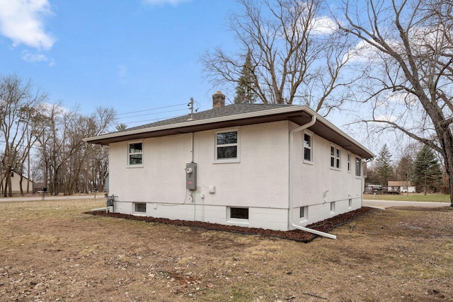 761 Labore Rd, Little Canada, MN 55117 - view of side of home with a chimney and a shingled roof