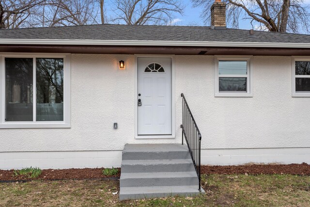 761 Labore Rd, Little Canada, MN 55117 - property entrance with roof with shingles and a chimney