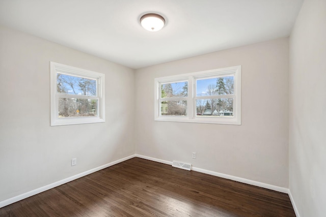 761 Labore Rd, Little Canada, MN 55117 - empty room with baseboards and dark wood-type flooring