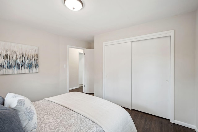 761 Labore Rd, Little Canada, MN 55117 - bedroom with a closet, dark wood-type flooring, and baseboards