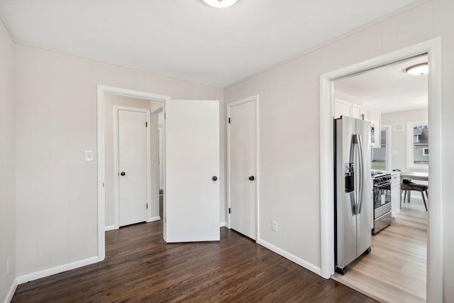 761 Labore Rd, Little Canada, MN 55117 - unfurnished bedroom with stainless steel fridge with ice dispenser, wood finished floors, and baseboards