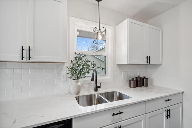 761 Labore Rd, Little Canada, MN 55117 - kitchen with a sink, backsplash, white cabinetry, and pendant lighting