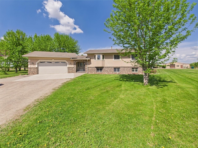31528 63rd St, Royalton, MN 56373 - tri-level home with an attached garage, driveway, a front yard, and stucco siding