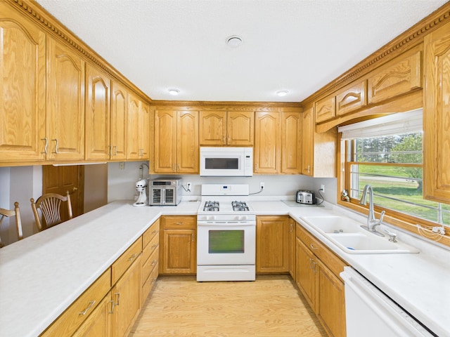 31528 63rd St, Royalton, MN 56373 - kitchen with white appliances, a sink, light countertops, and light wood finished floors