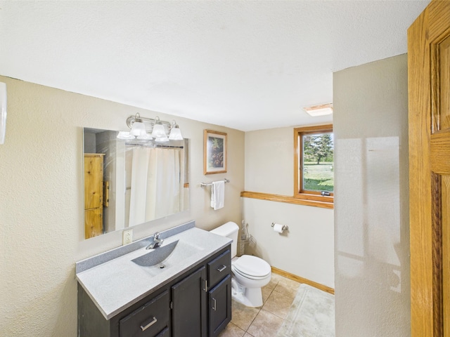 31528 63rd St, Royalton, MN 56373 - bathroom with toilet, vanity, tile patterned floors, and baseboards